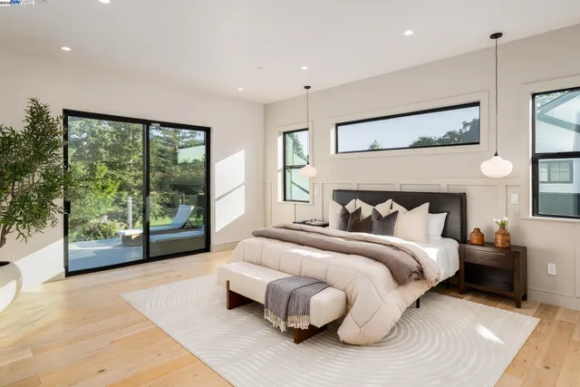 a bathroom with a white tub shower vanity and a sink