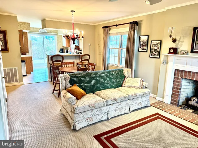 a bedroom with furniture and a chandelier