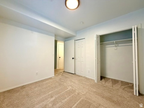 11895 Inauguration Road Draper, UT 84020 - Photo 12 of 13 Wall-to-wall carpeting in a neutral tone, white walls, and a ceiling-mounted light fixture