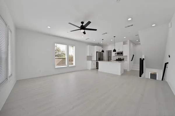 a view of a kitchen with furniture and a window