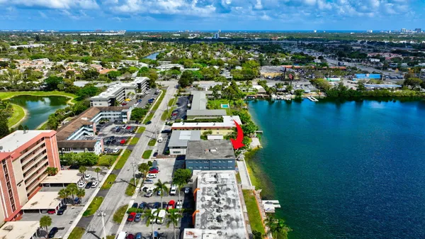 an aerial view of residential building and lake