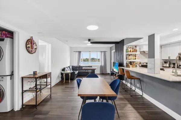 a view of a dining room with furniture and wooden floor