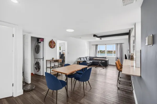 a kitchen with stainless steel appliances a sink stove and cabinets
