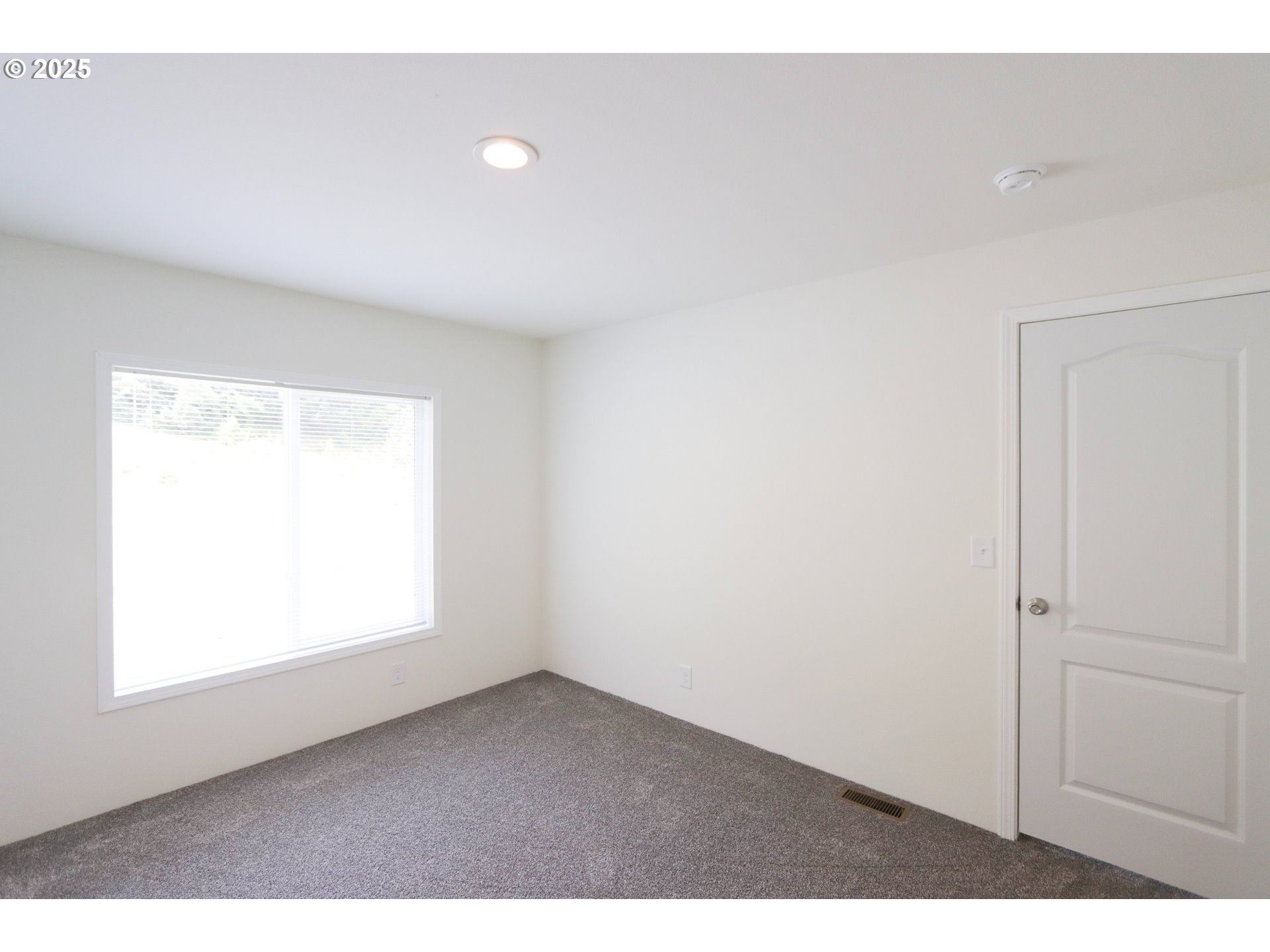 425 Providence Drive Reedsport, OR 97467 - Photo 18 of 33 a view of an empty room and a window