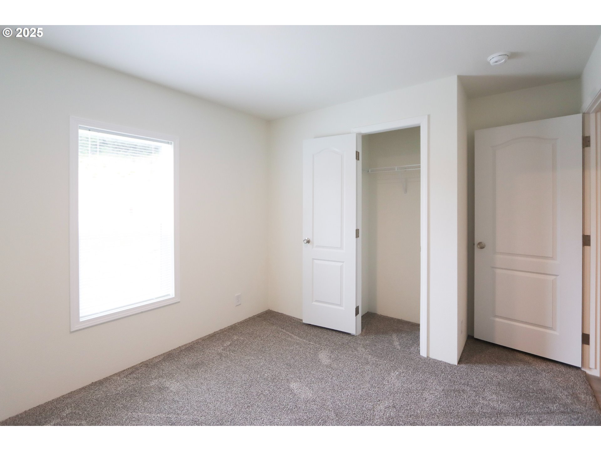 425 Providence Drive Reedsport, OR 97467 - Photo 21 of 33 a big room with windows and closet