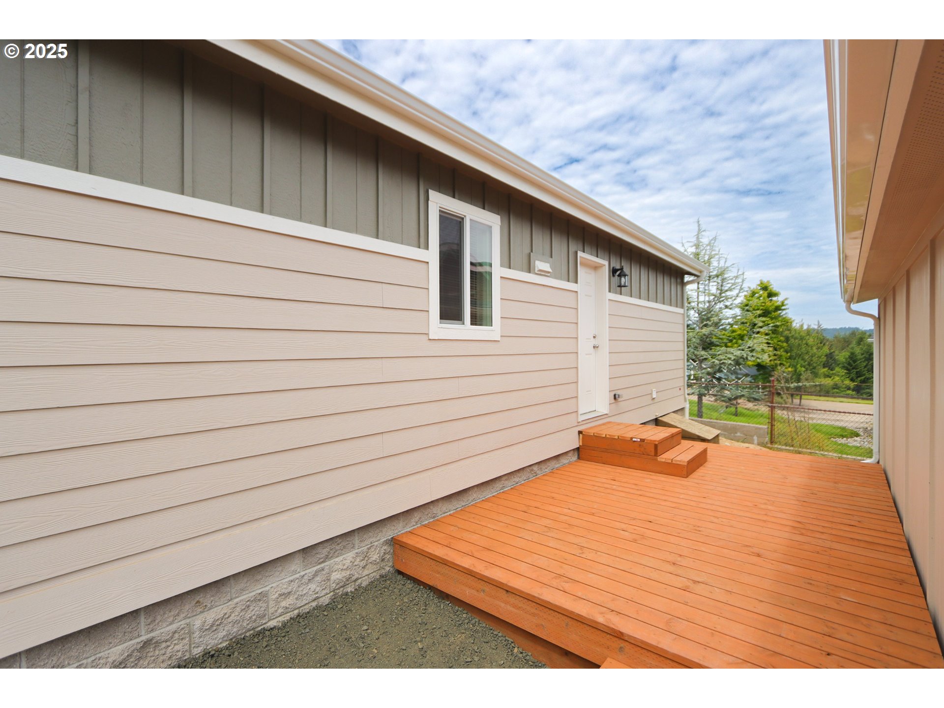 425 Providence Drive Reedsport, OR 97467 - Photo 22 of 33 a backyard of a house with seating space