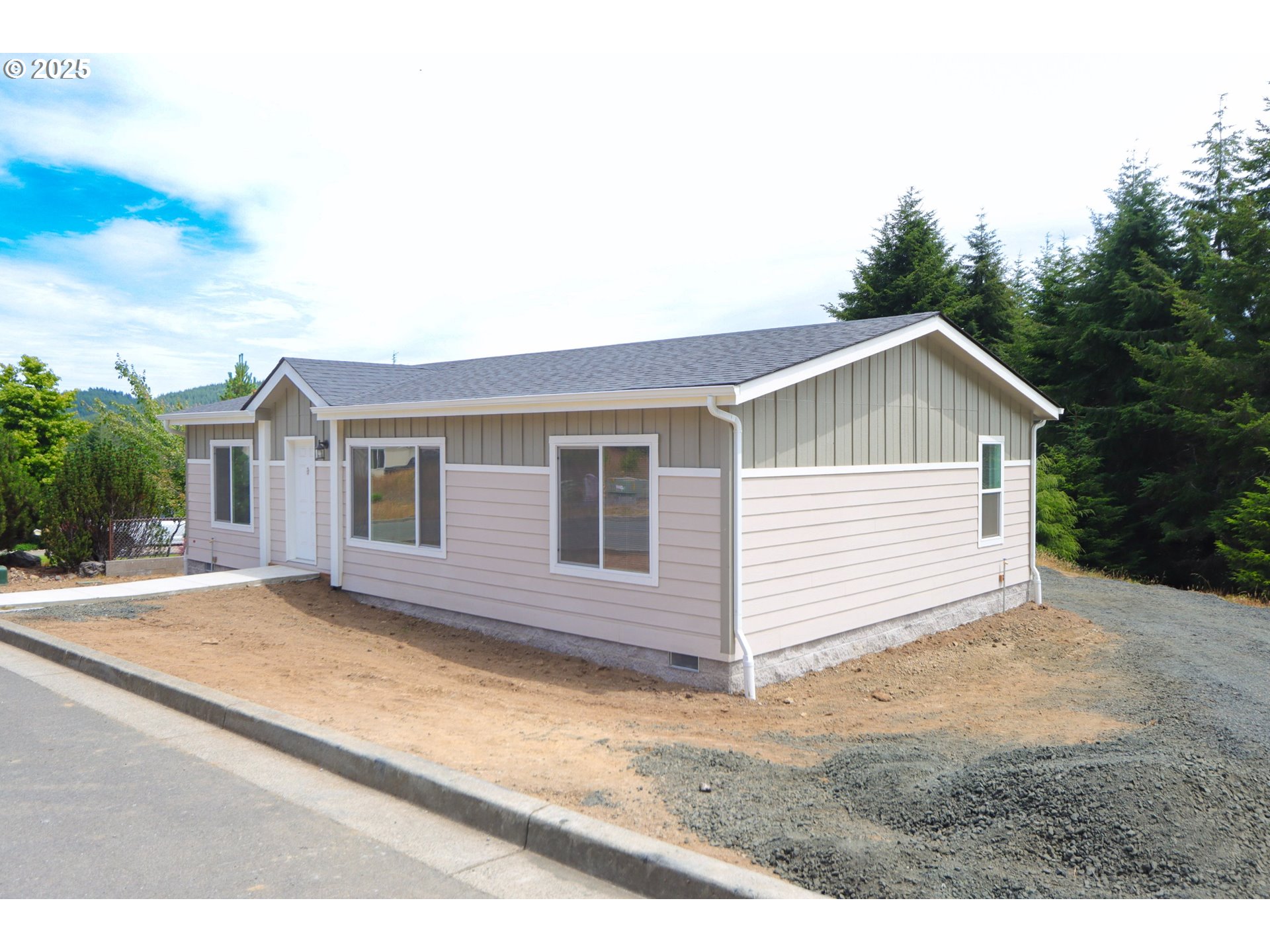 425 Providence Drive Reedsport, OR 97467 - Photo 33 of 33 a view of a house with backyard and garden