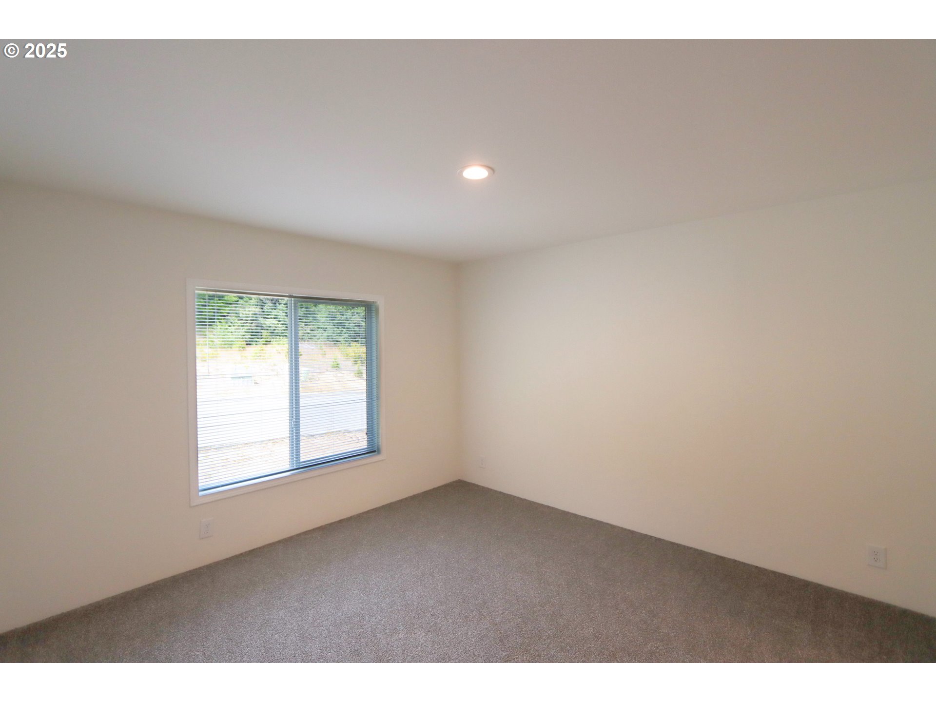 425 Providence Drive Reedsport, OR 97467 - Photo 10 of 33 a view of an empty room with a window