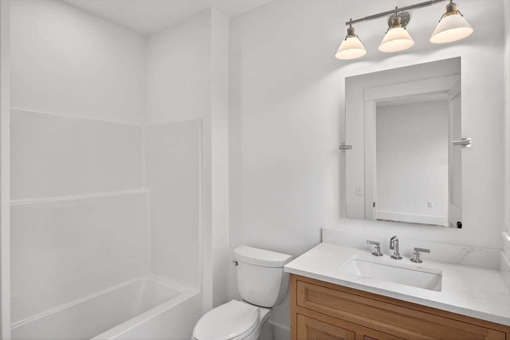 132 Great Western Road Harwich, MA 02645 - Photo 31 of 42 a bathroom with a sink a toilet and a bathtub