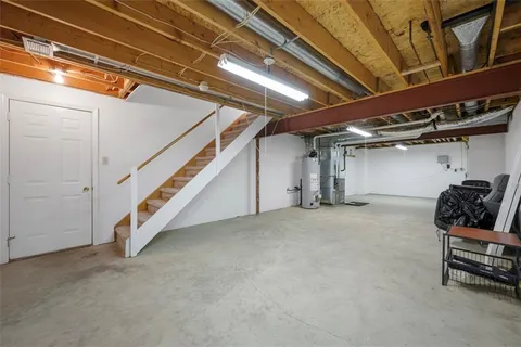 a view of an empty room with stairs