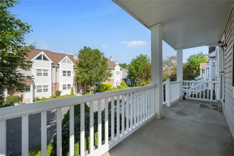 a view of a house with a small yard