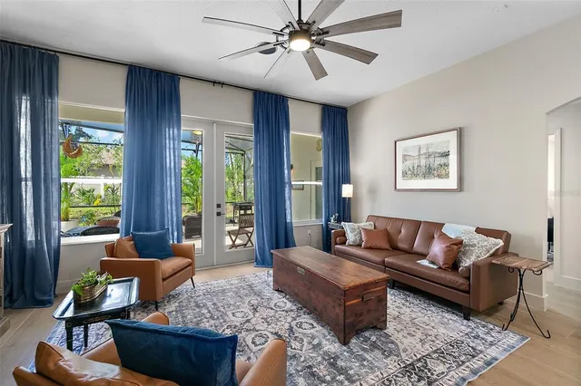 a living room with furniture and kitchen view