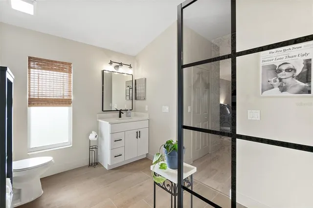 a bedroom with a bed and a table in it