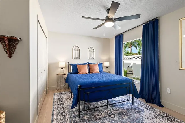 a bedroom with a bed and a window