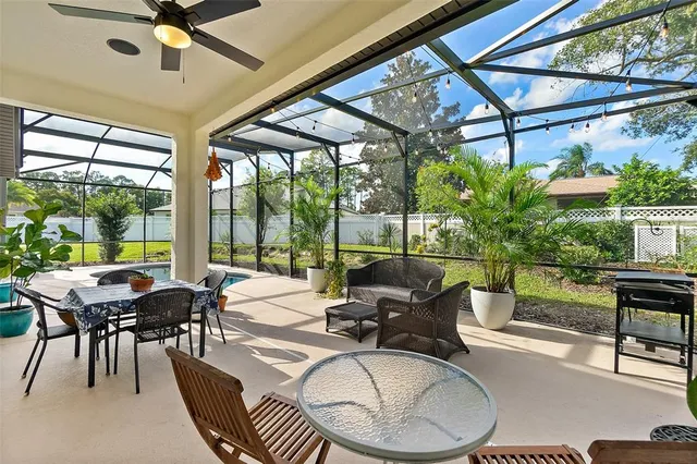 a view of a patio with swimming pool table and chairs