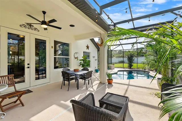 a view of backyard with a tub and outdoor seating