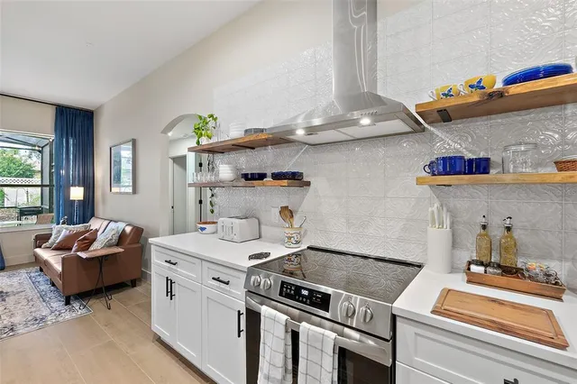 a kitchen that has a lot of cabinets