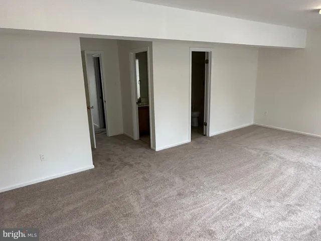 a bathroom with a toilet and shower