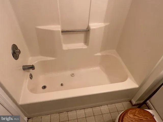 a view of a hallway with a wooden cabinets