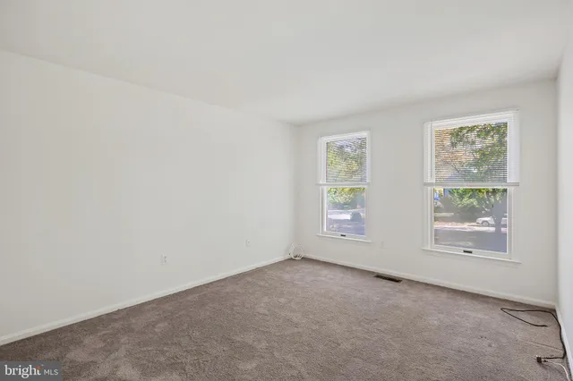 an empty room with closet area