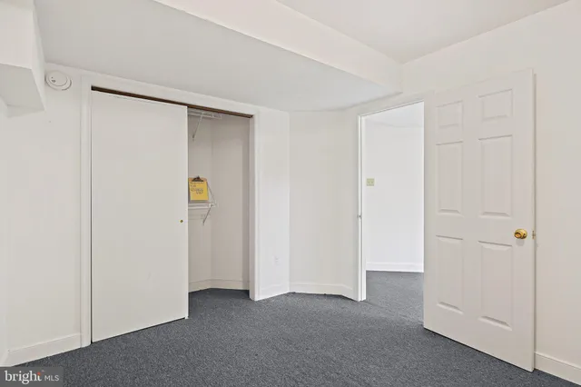 a bathroom with a sink vanity granite shower and a mirror