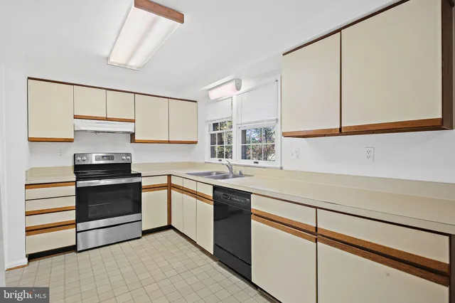 a bathroom with a sink a mirror and a shower