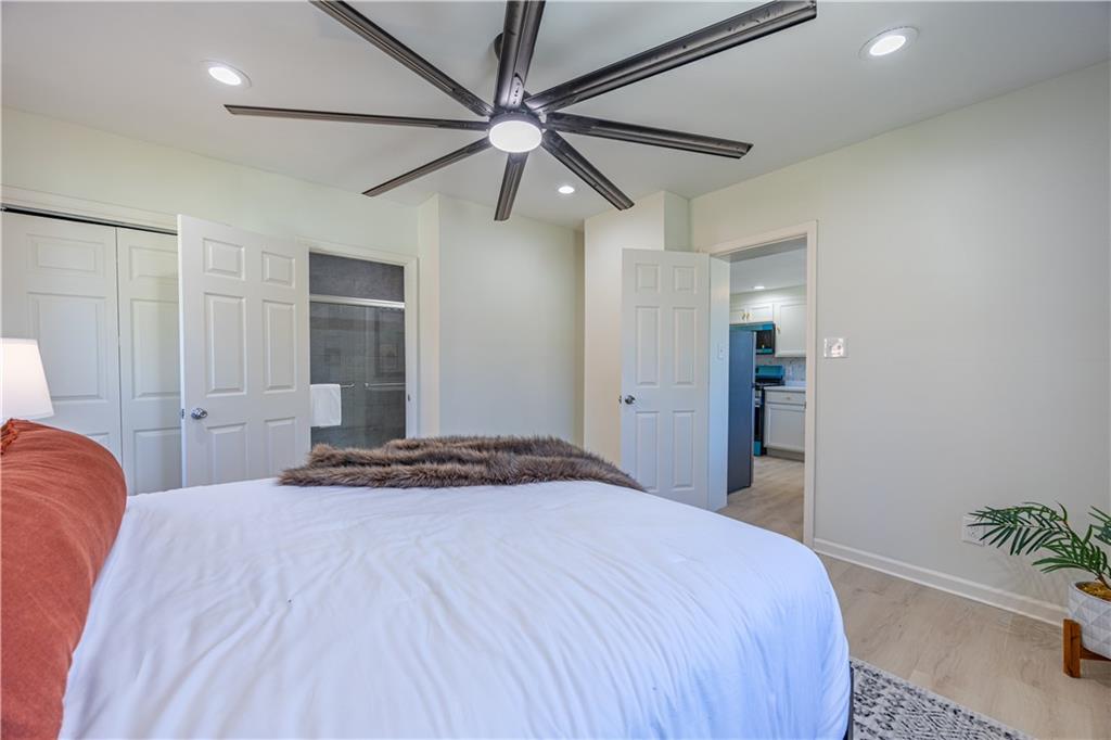 117 Oak Avenue Penn Hills, PA 15235 - Photo 12 of 26 a bedroom with a bed and a chandelier