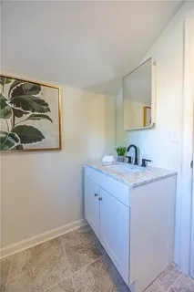 a bathroom with a sink and a mirror