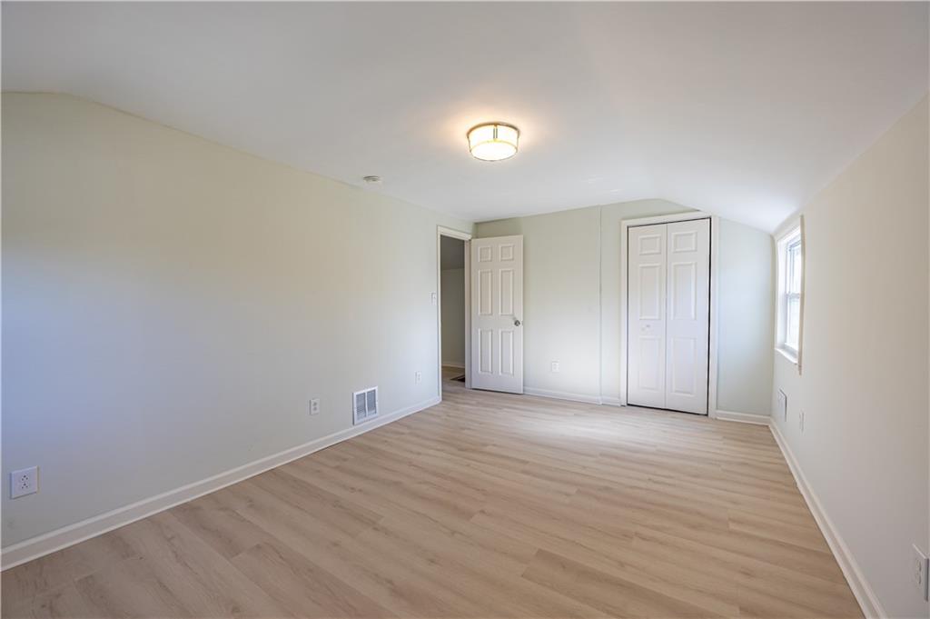 117 Oak Avenue Penn Hills, PA 15235 - Photo 20 of 26 a view of an empty room with wooden floor