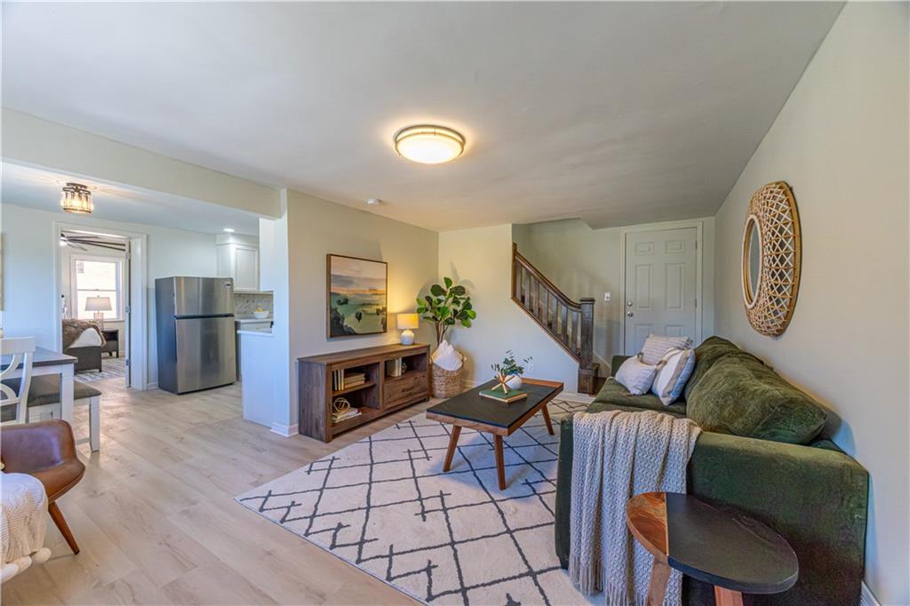 117 Oak Avenue Penn Hills, PA 15235 - Photo 3 of 26 a living room with furniture and a wooden floor