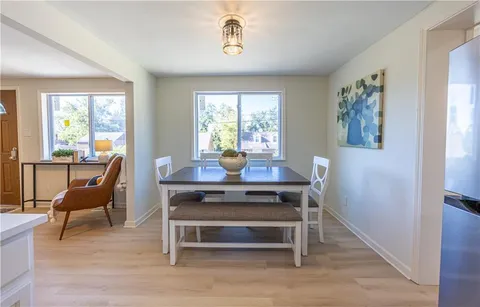 a view of a dining room with furniture window and outside view