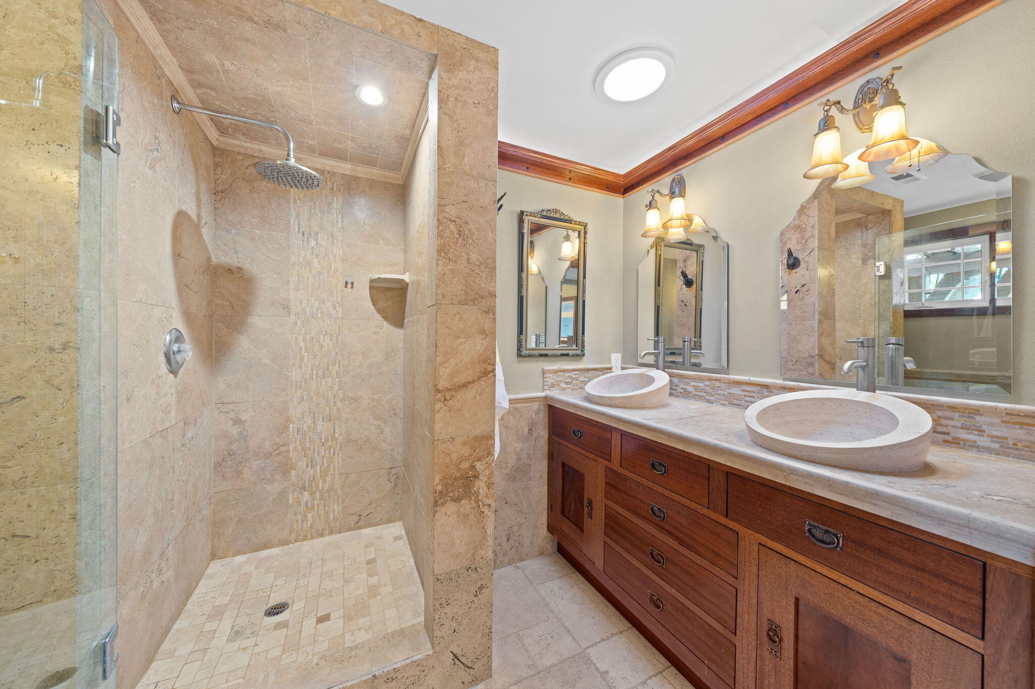 21925 Bear Creek Road Bend, OR 97702 - Photo 40 of 104 a bathroom with a double vanity sink mirror and shower