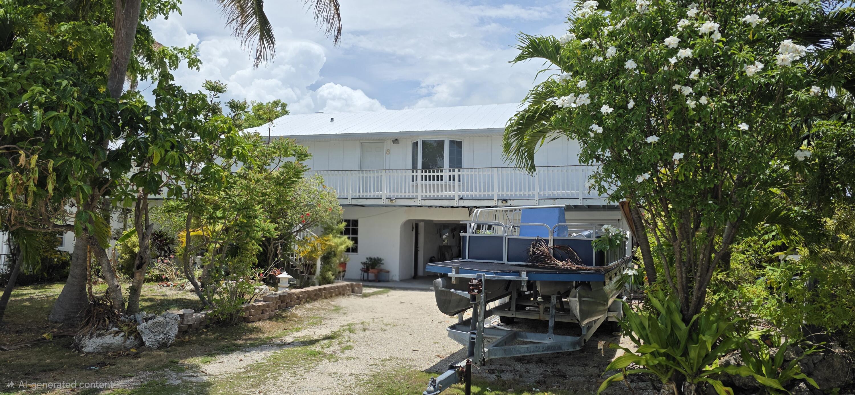8 Emerald Drive Key West, FL 33040 - Photo 1 of 43 a view of backyard with table and chairs and potted plants