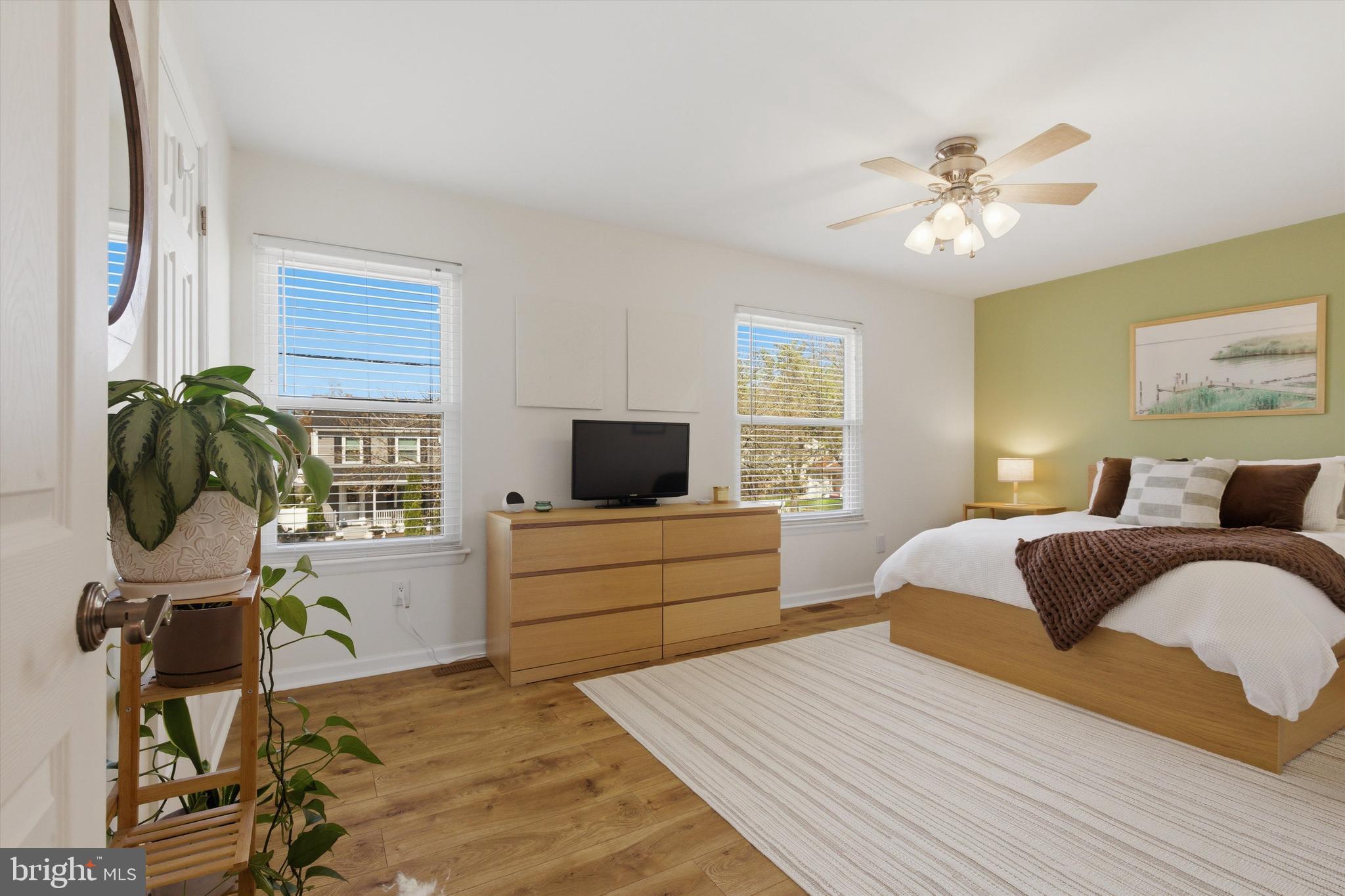 101 Cottage Grove Drive Pasadena, MD 21122 - Photo 13 of 35 a bedroom with a bed and a flat screen tv