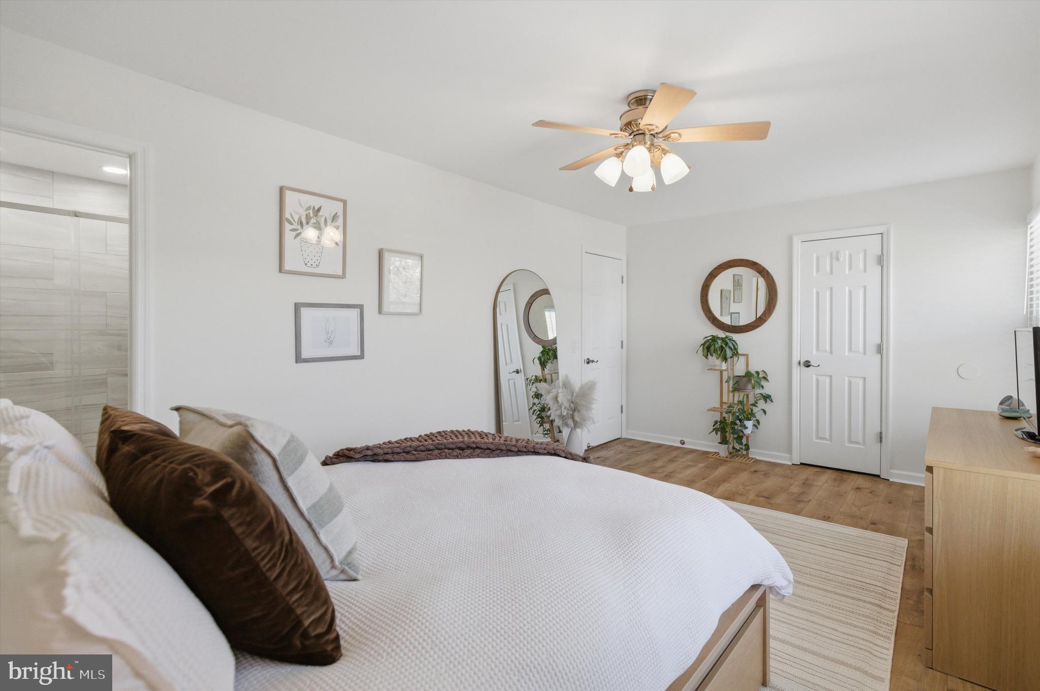 101 Cottage Grove Drive Pasadena, MD 21122 - Photo 14 of 35 a bedroom with a bed and a chandelier