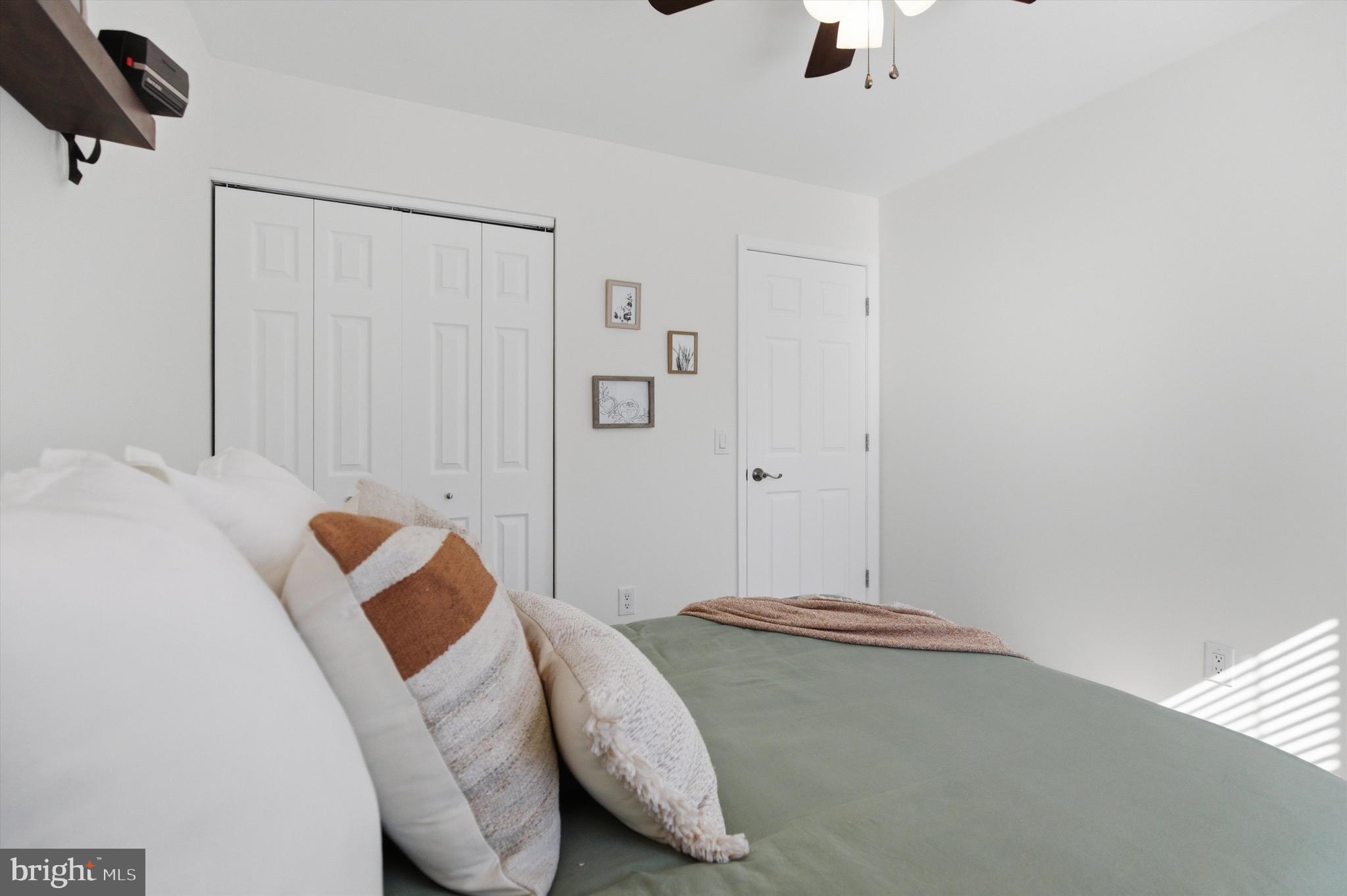 101 Cottage Grove Drive Pasadena, MD 21122 - Photo 17 of 35 a bedroom with a bed and a couch