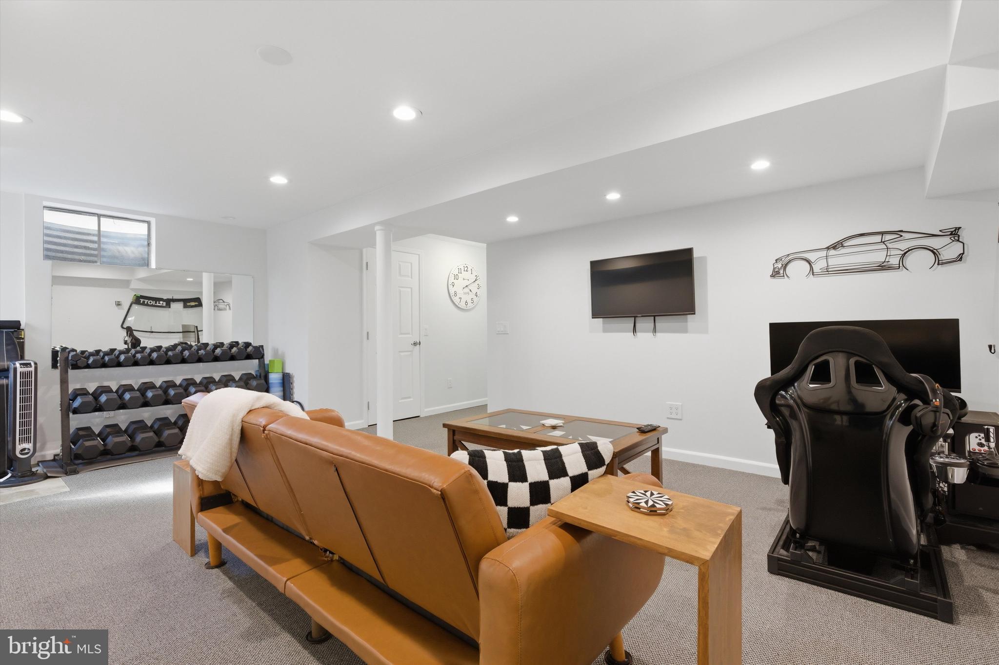 101 Cottage Grove Drive Pasadena, MD 21122 - Photo 24 of 35 a living room with furniture and a flat screen tv