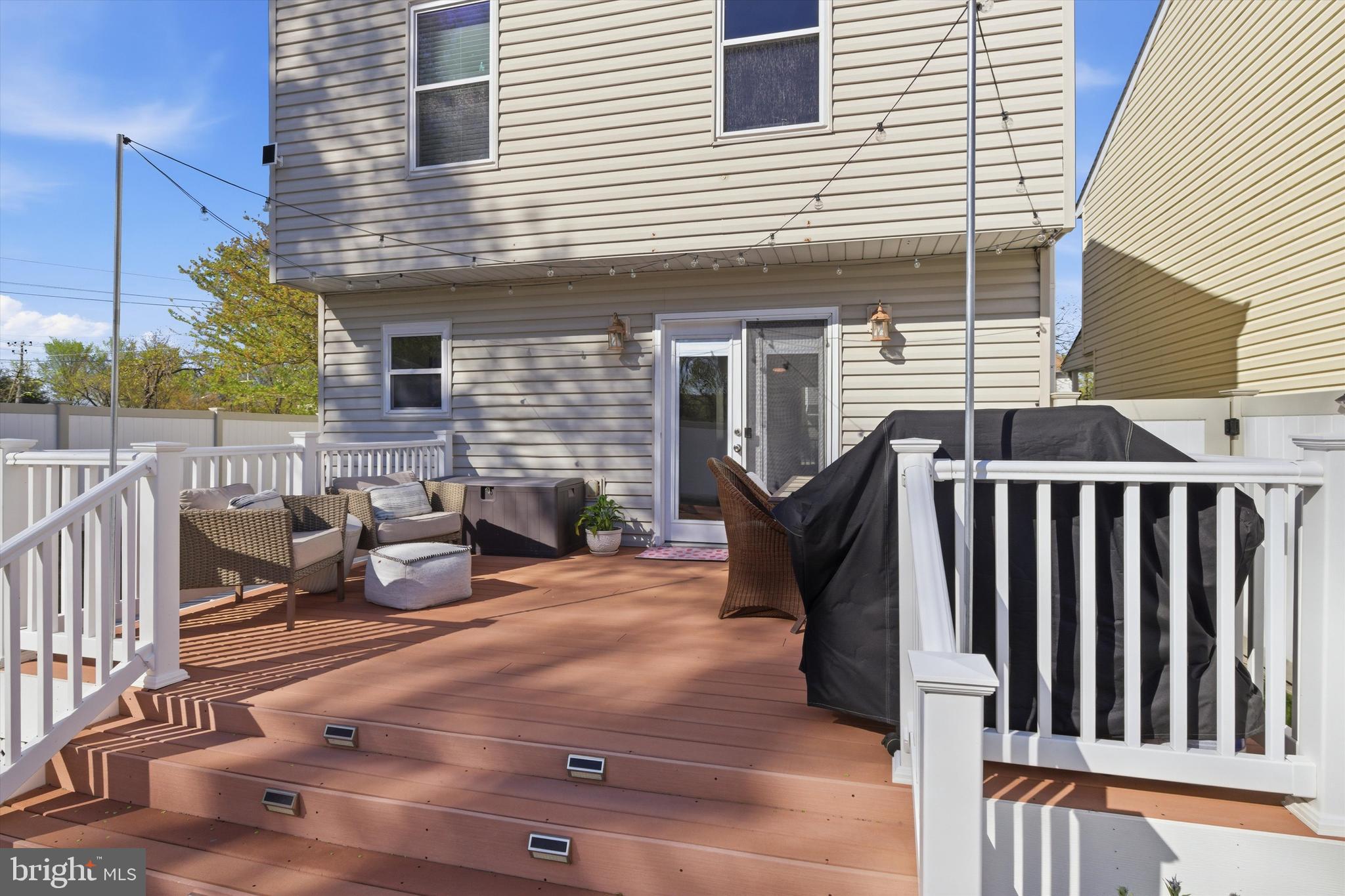 101 Cottage Grove Drive Pasadena, MD 21122 - Photo 25 of 35 a view of a patio with a table and chairs
