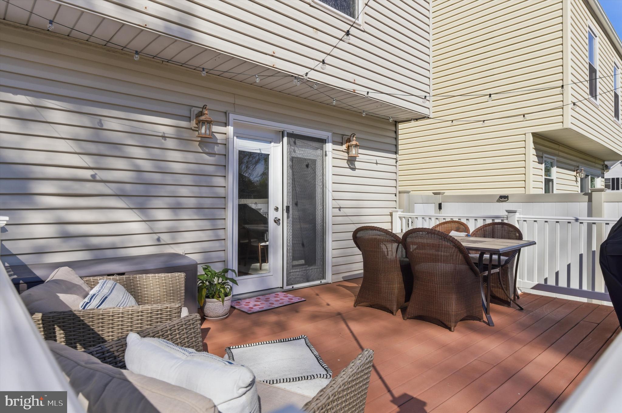 101 Cottage Grove Drive Pasadena, MD 21122 - Photo 26 of 35 a balcony with furniture and a potted plant