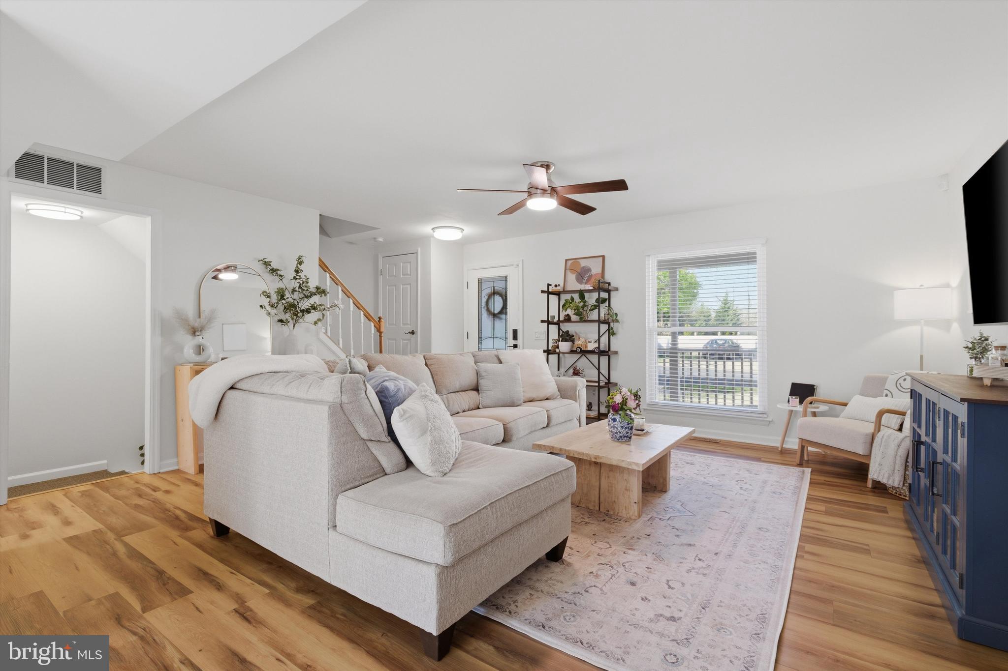 101 Cottage Grove Drive Pasadena, MD 21122 - Photo 7 of 35 a living room with furniture and a wooden floor
