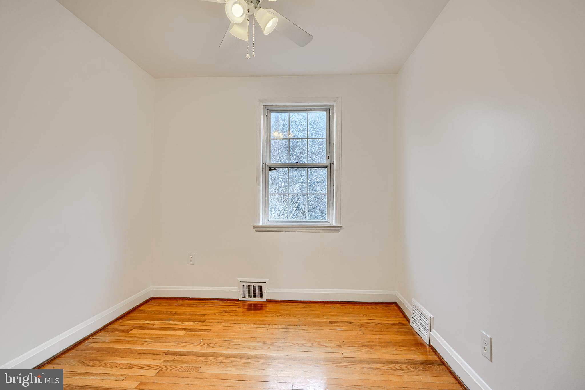 8235 Pleasant Plains Road Towson, MD 21286 - Photo 14 of 42 a view of a room with window and wooden floor