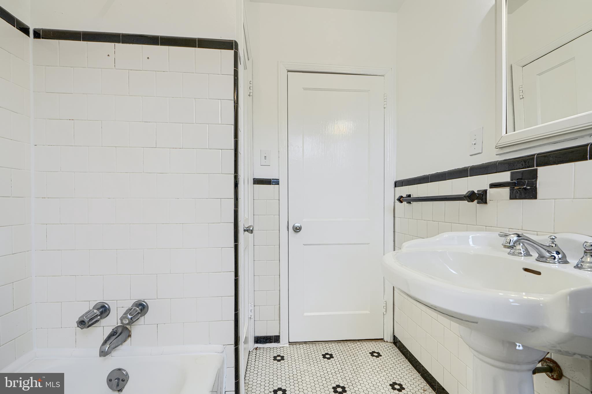 8235 Pleasant Plains Road Towson, MD 21286 - Photo 18 of 42 a bathroom with a bathtub and a sink