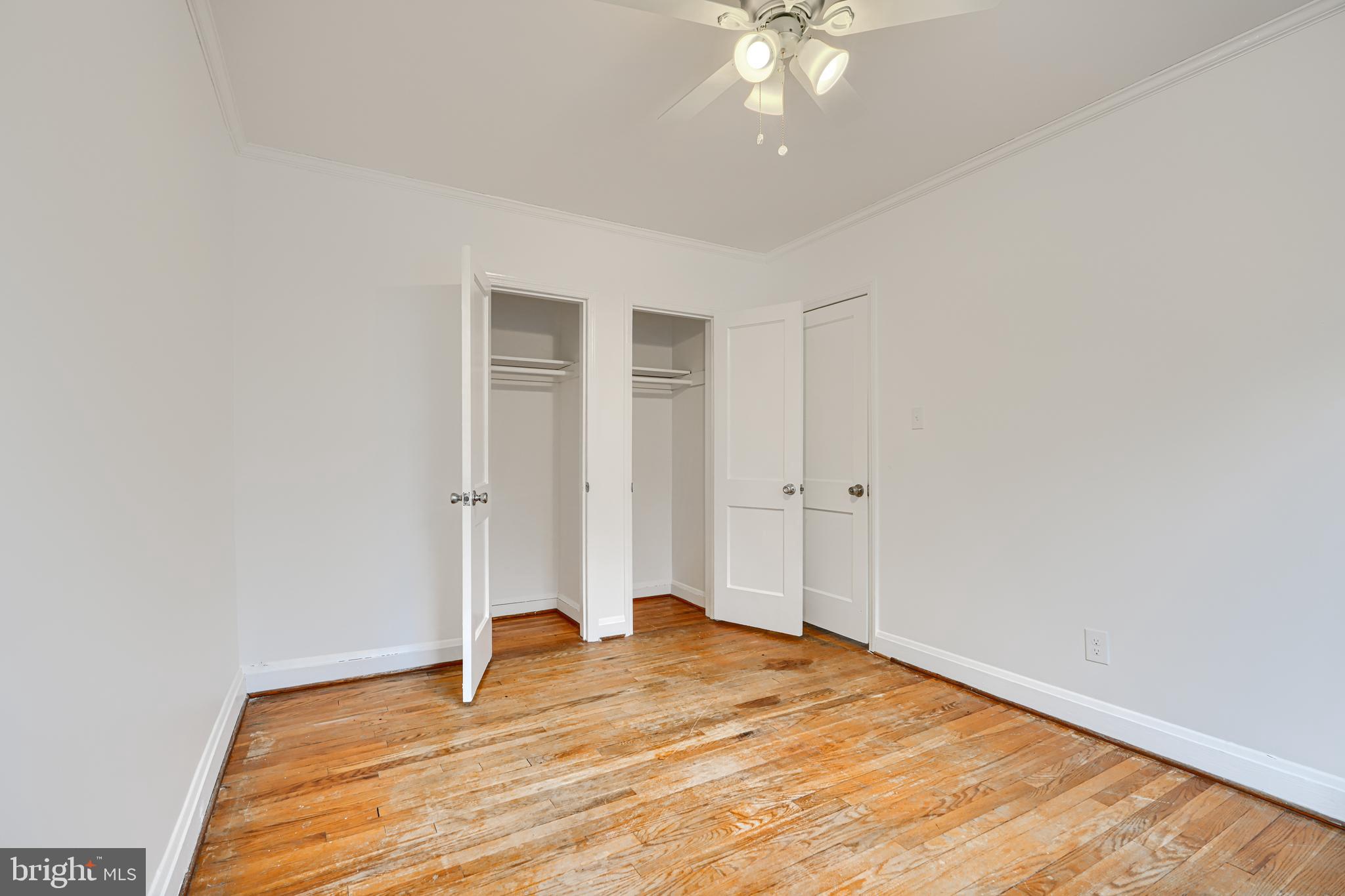 8235 Pleasant Plains Road Towson, MD 21286 - Photo 22 of 42 a view of a room with wooden floor and ceiling fan