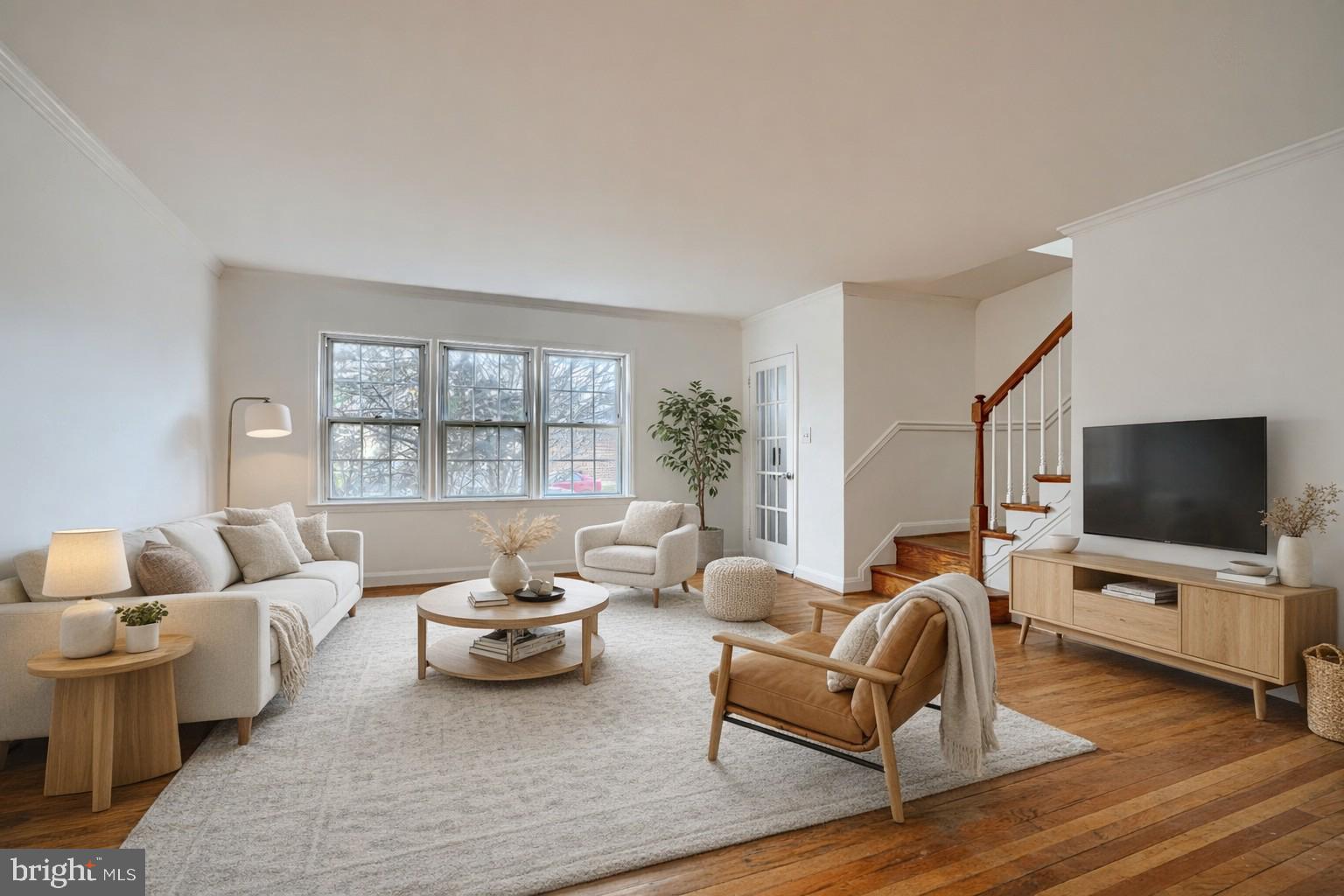 8235 Pleasant Plains Road Towson, MD 21286 - Photo 3 of 42 a living room with furniture and a flat screen tv