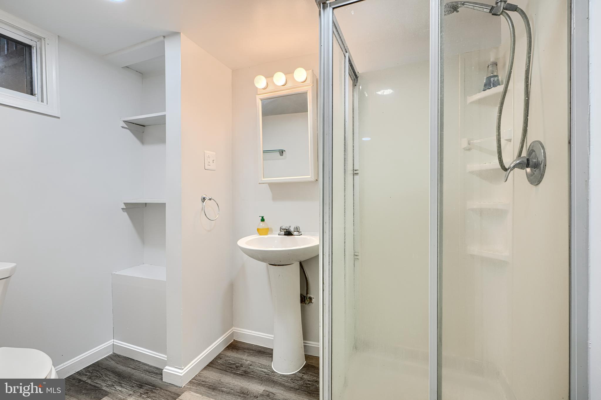 8235 Pleasant Plains Road Towson, MD 21286 - Photo 32 of 42 a bathroom with a sink toilet and shower