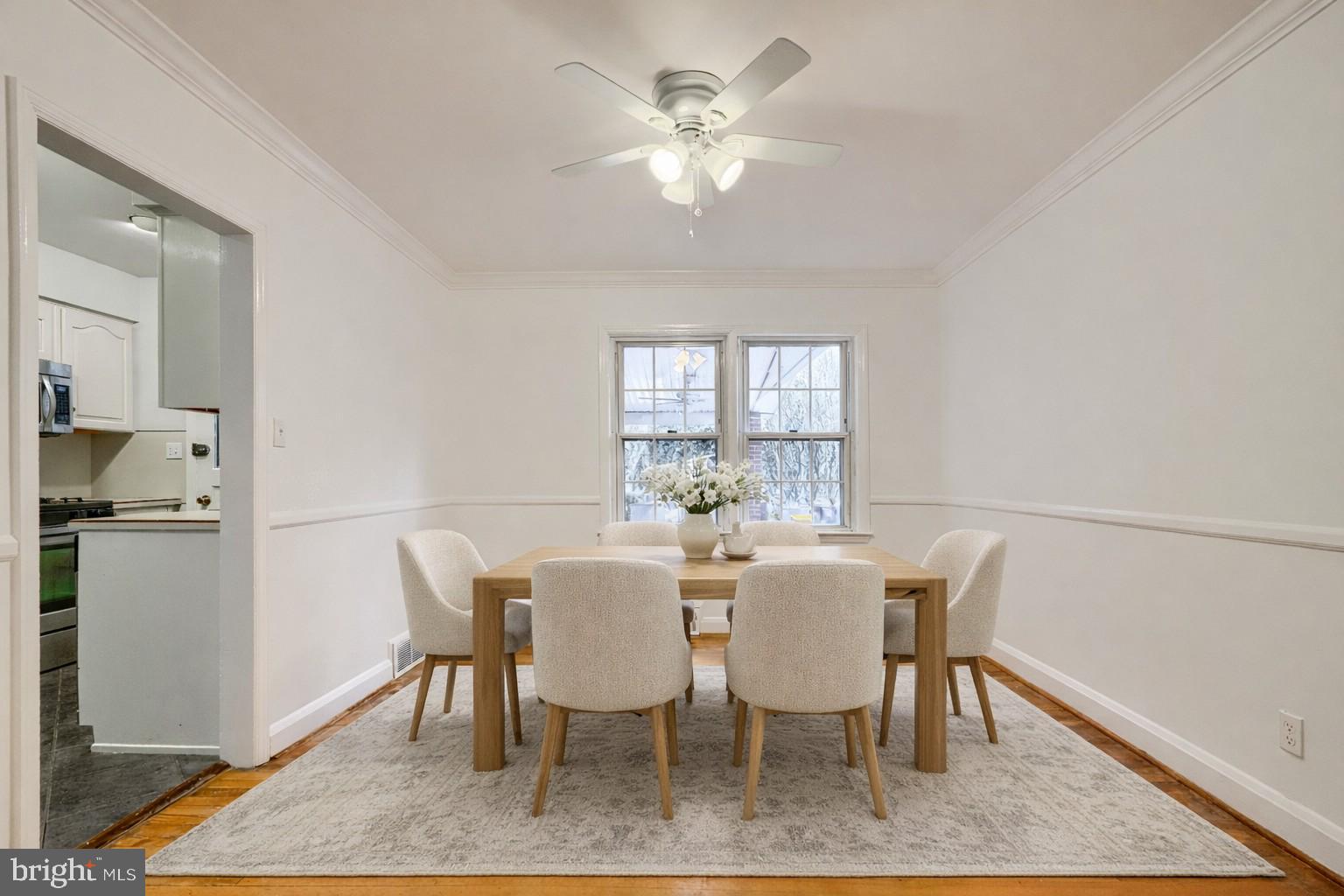 8235 Pleasant Plains Road Towson, MD 21286 - Photo 7 of 42 a view of a dining room with furniture and a chandelier