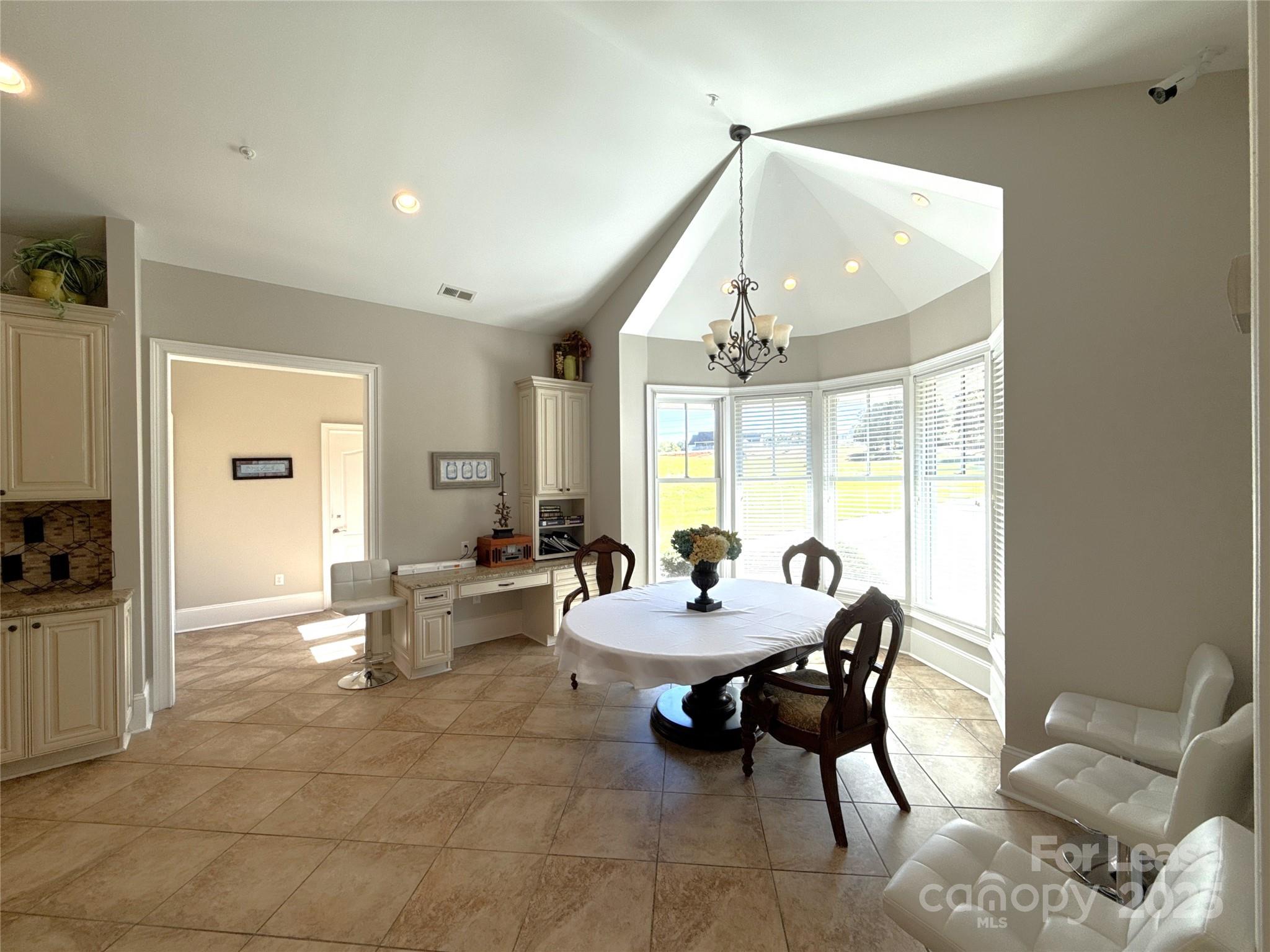 14019 Thompson Road Charlotte, NC 28227 - Photo 14 of 43 a dining room with furniture and wooden floor
