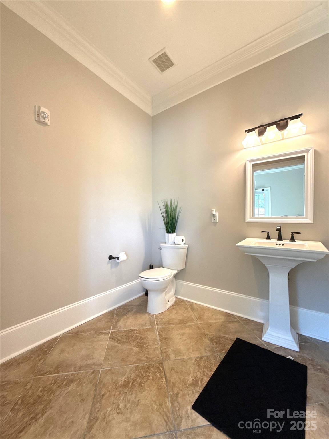 14019 Thompson Road Charlotte, NC 28227 - Photo 18 of 43 a bathroom with a sink mirror and toilet