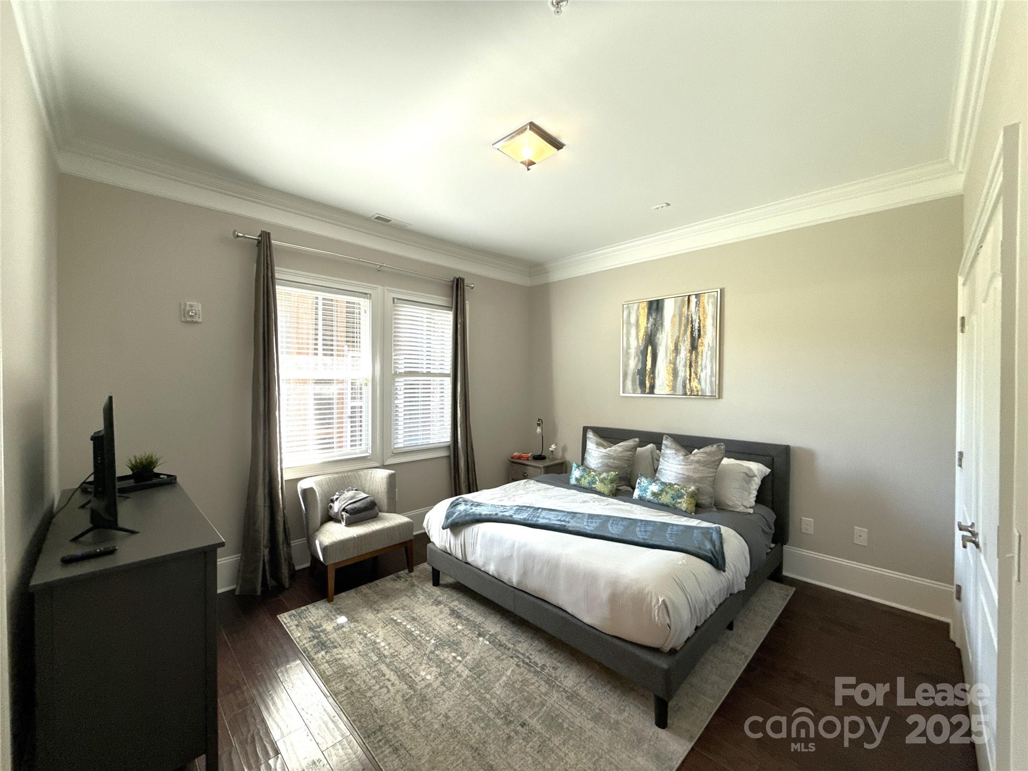 14019 Thompson Road Charlotte, NC 28227 - Photo 26 of 43 a bedroom with a bed and wooden floor