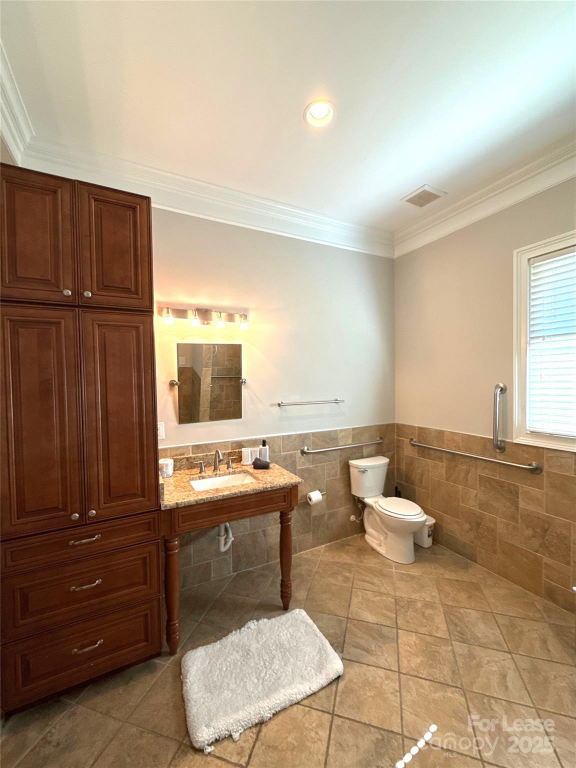 14019 Thompson Road Charlotte, NC 28227 - Photo 27 of 43 a bathroom with a sink toilet and mirror